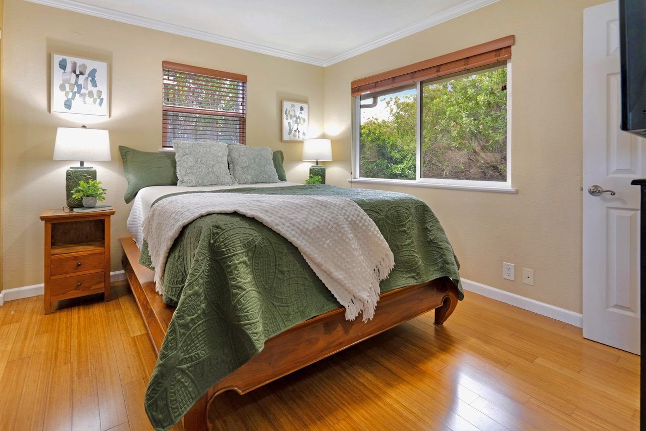 1115 Pookela Road Makawao, HI 96768 - Photo 17 of 37 a bedroom with a bed and wooden floor