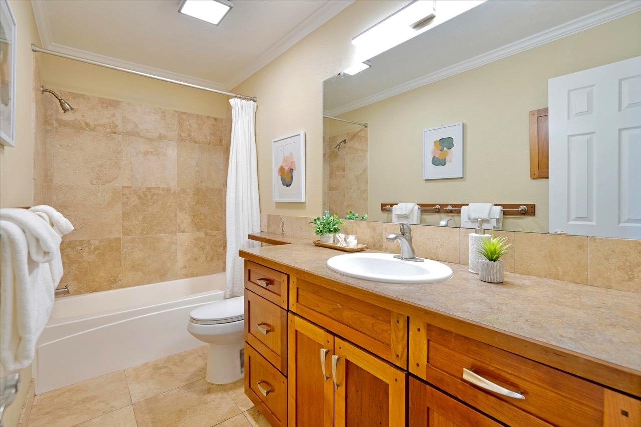 1115 Pookela Road Makawao, HI 96768 - Photo 24 of 37 a bathroom with a granite countertop sink toilet and shower