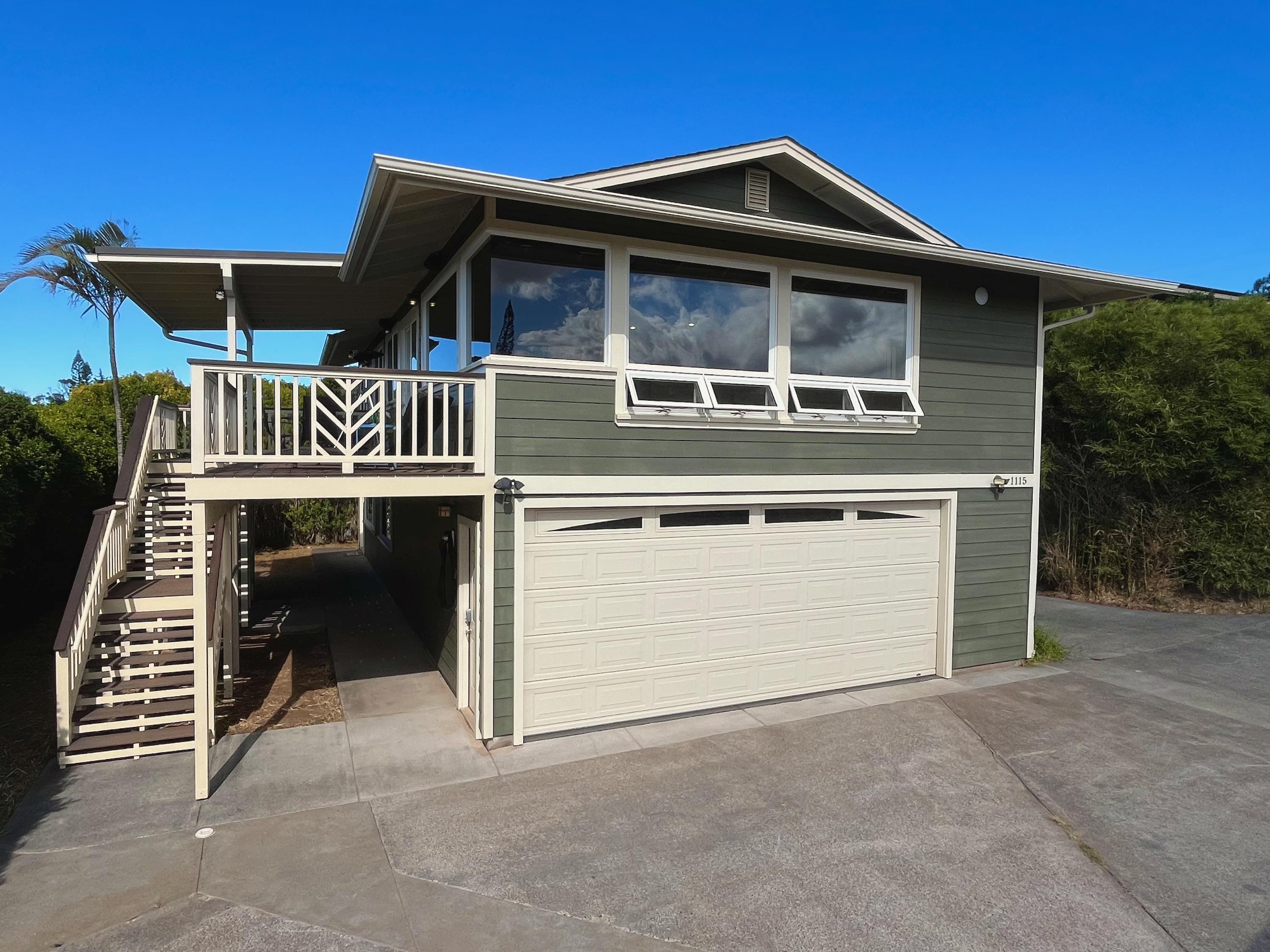 1115 Pookela Road Makawao, HI 96768 - Photo 3 of 37 a front view of a house with a garage