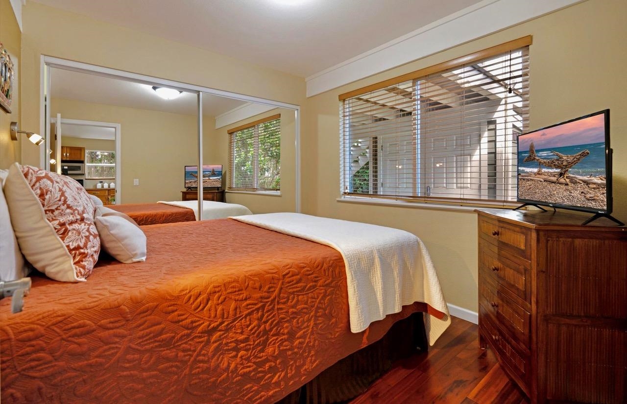 1115 Pookela Road Makawao, HI 96768 - Photo 31 of 37 a bedroom with a bed and a large window