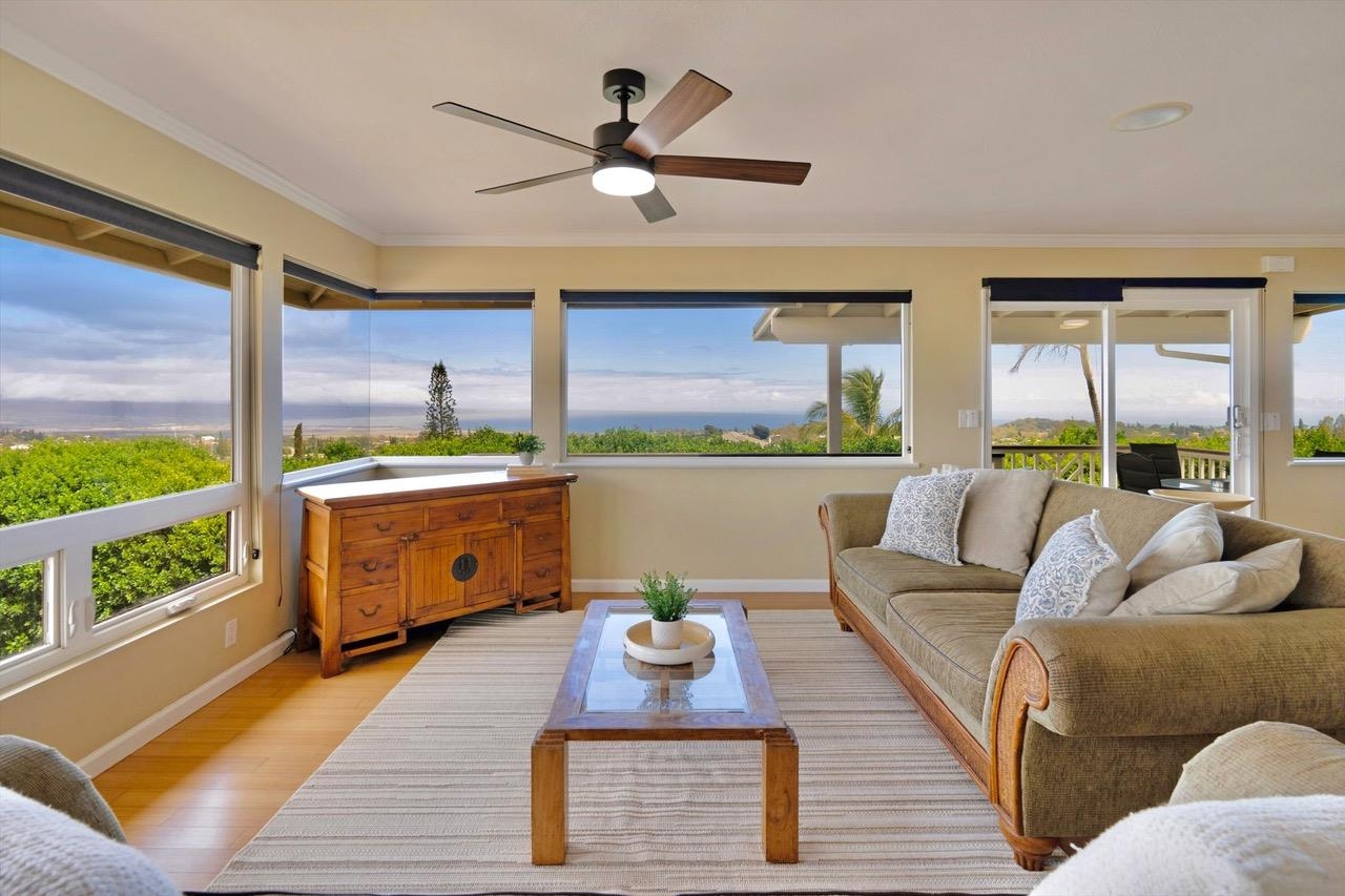 1115 Pookela Road Makawao, HI 96768 - Photo 5 of 37 a living room with furniture a large window with kitchen view