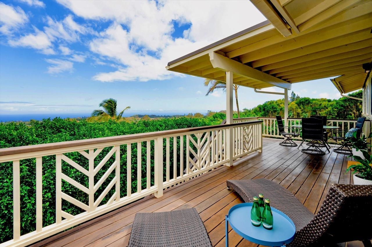 1115 Pookela Road Makawao, HI 96768 - Photo 10 of 37 a view of balcony with furniture and umbrella
