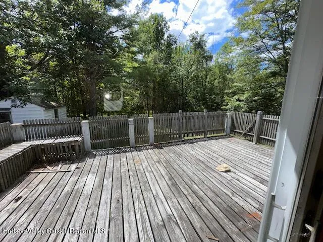 a view of deck with wooden floor and outdoor seating