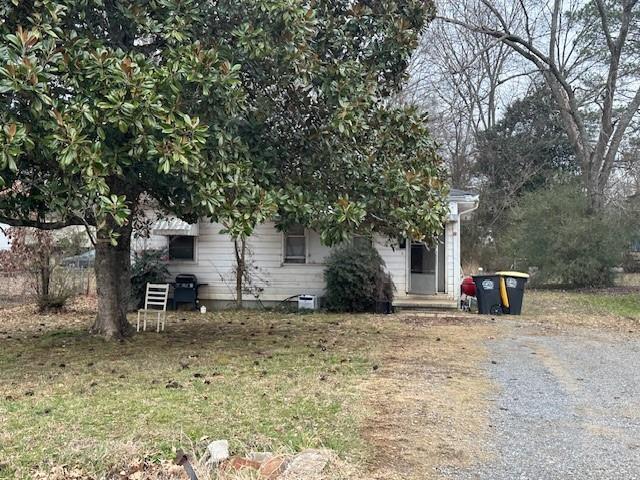 501 Cotton Avenue Southwest Rome, GA 30161 - Photo 1 of 1 a view of a house with large tree and wooden fence