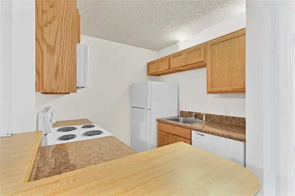 a bedroom with a bed and cabinets