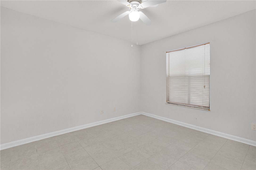 1136 Breezy Way, Unit 3B Sebastian, FL 32958 - Photo 17 of 34 an empty room with a window
