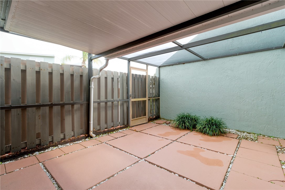 1136 Breezy Way, Unit 3B Sebastian, FL 32958 - Photo 23 of 34 a backyard of a house