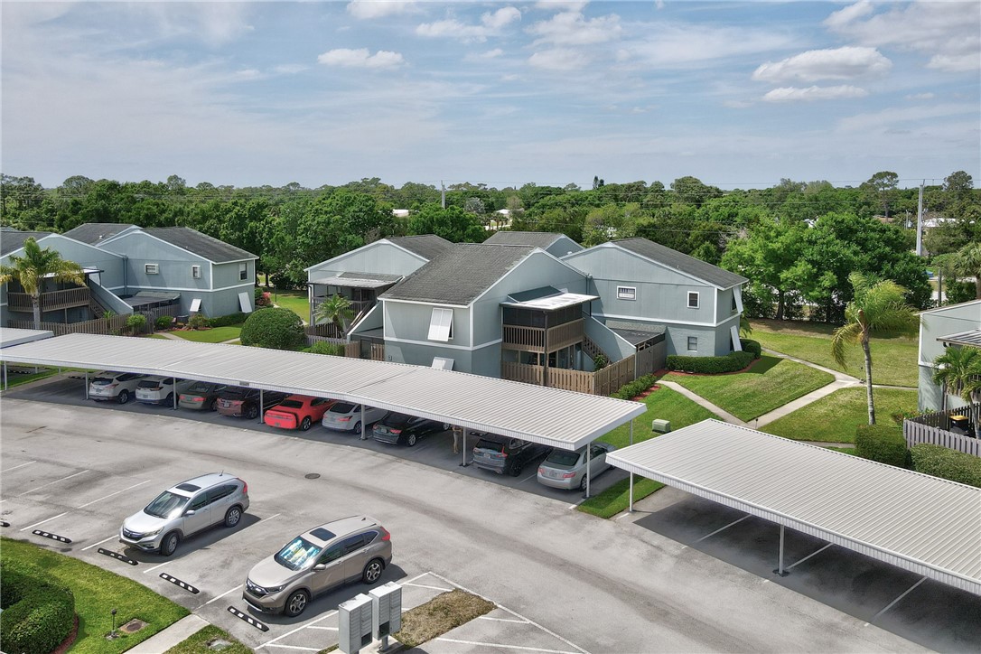 1136 Breezy Way, Unit 3B Sebastian, FL 32958 - Photo 24 of 34 an aerial view of a house with porch