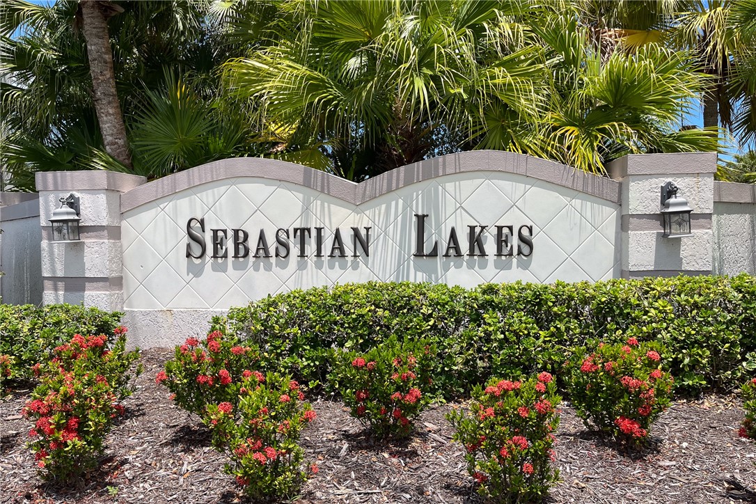 1136 Breezy Way, Unit 3B Sebastian, FL 32958 - Photo 25 of 34 a sign on the side of the road