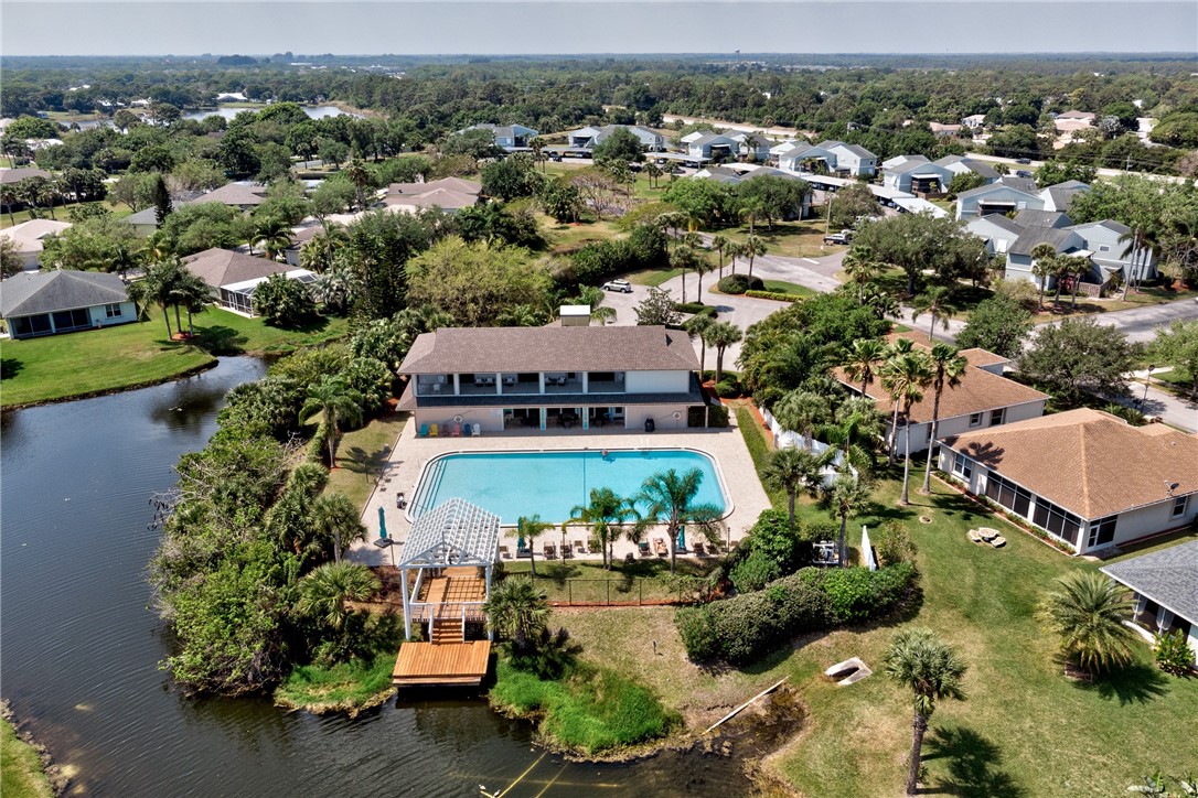 1136 Breezy Way, Unit 3B Sebastian, FL 32958 - Photo 26 of 34 an aerial view of a house with a yard and lake view