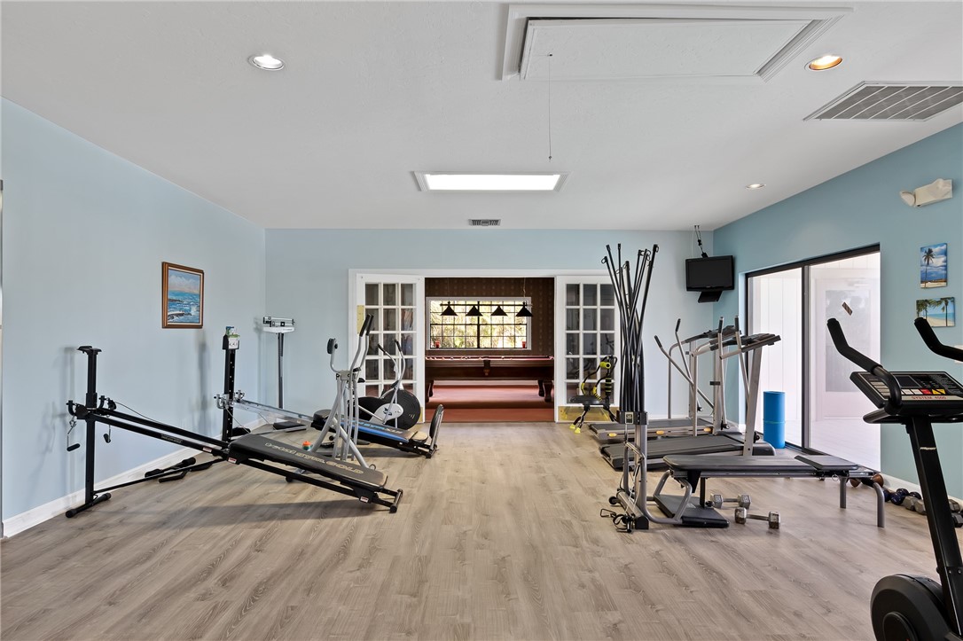 1136 Breezy Way, Unit 3B Sebastian, FL 32958 - Photo 32 of 34 a view of a room with gym equipment