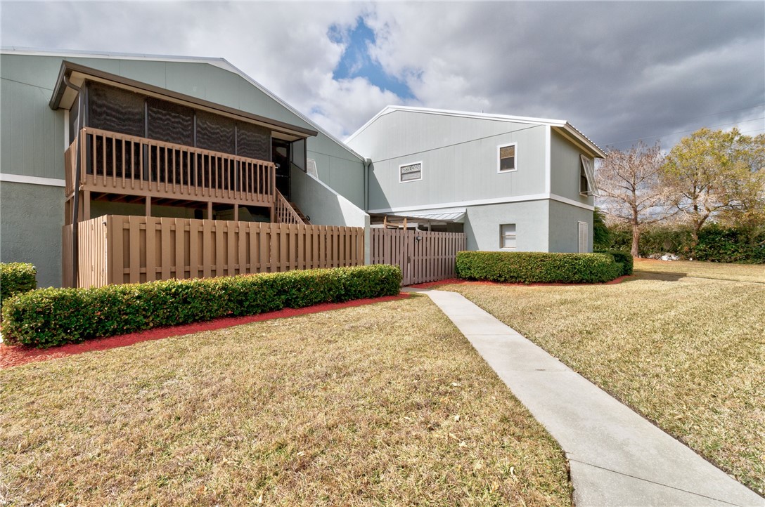 1136 Breezy Way, Unit 3B Sebastian, FL 32958 - Photo 4 of 34 a view of backyard of house