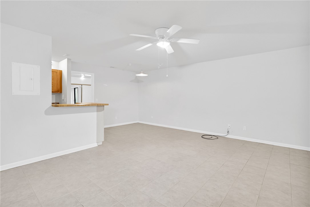 1136 Breezy Way, Unit 3B Sebastian, FL 32958 - Photo 8 of 34 an empty room with a bathroom