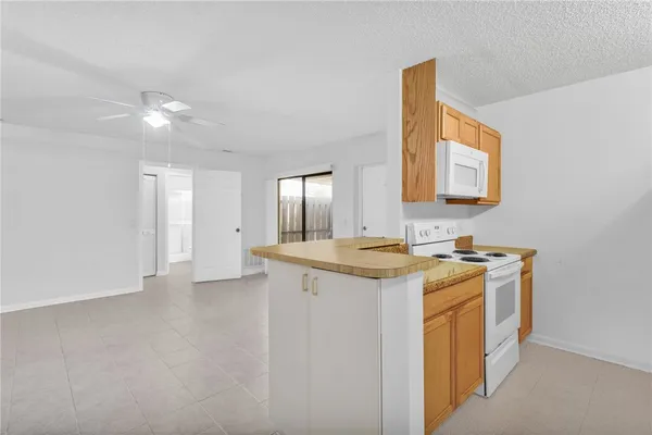a view of a kitchen with a sink and dishwasher