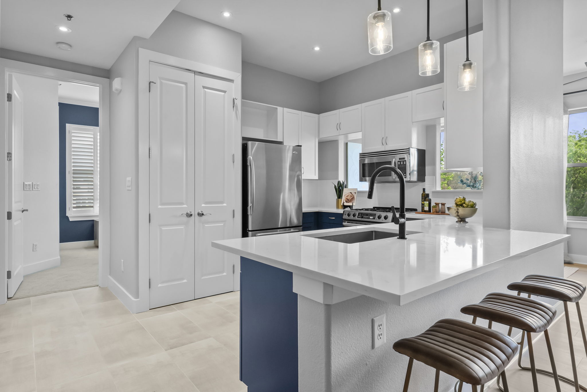 Chef's kitchen!  Quartz countertops and bar seating. Excellent for hanging out & entertaining.