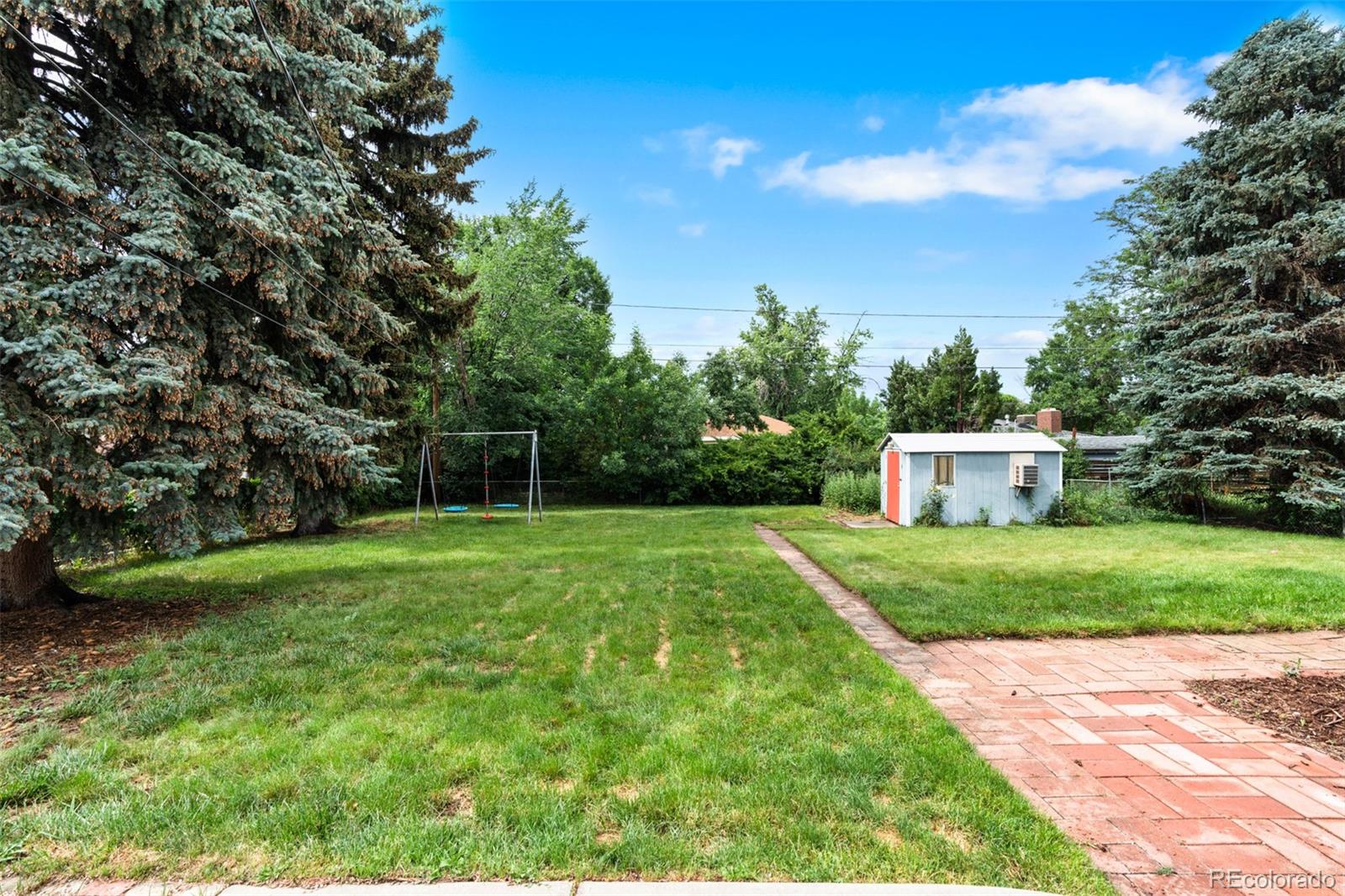 6755 West 45th Avenue Wheat Ridge, CO 80033 - Photo 25 of 27 a view of a house with backyard and garden