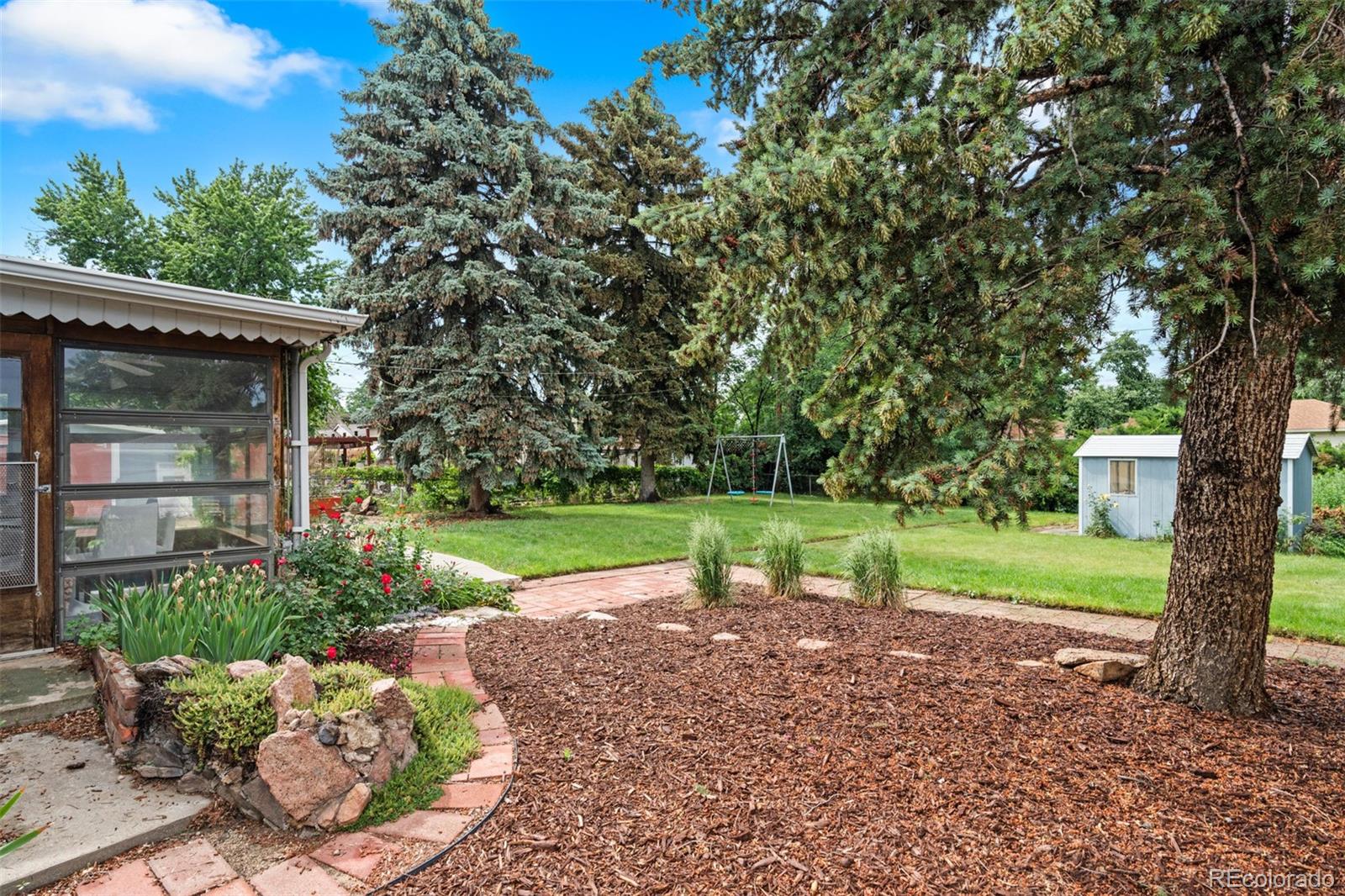 6755 West 45th Avenue Wheat Ridge, CO 80033 - Photo 26 of 27 a view of backyard with green space