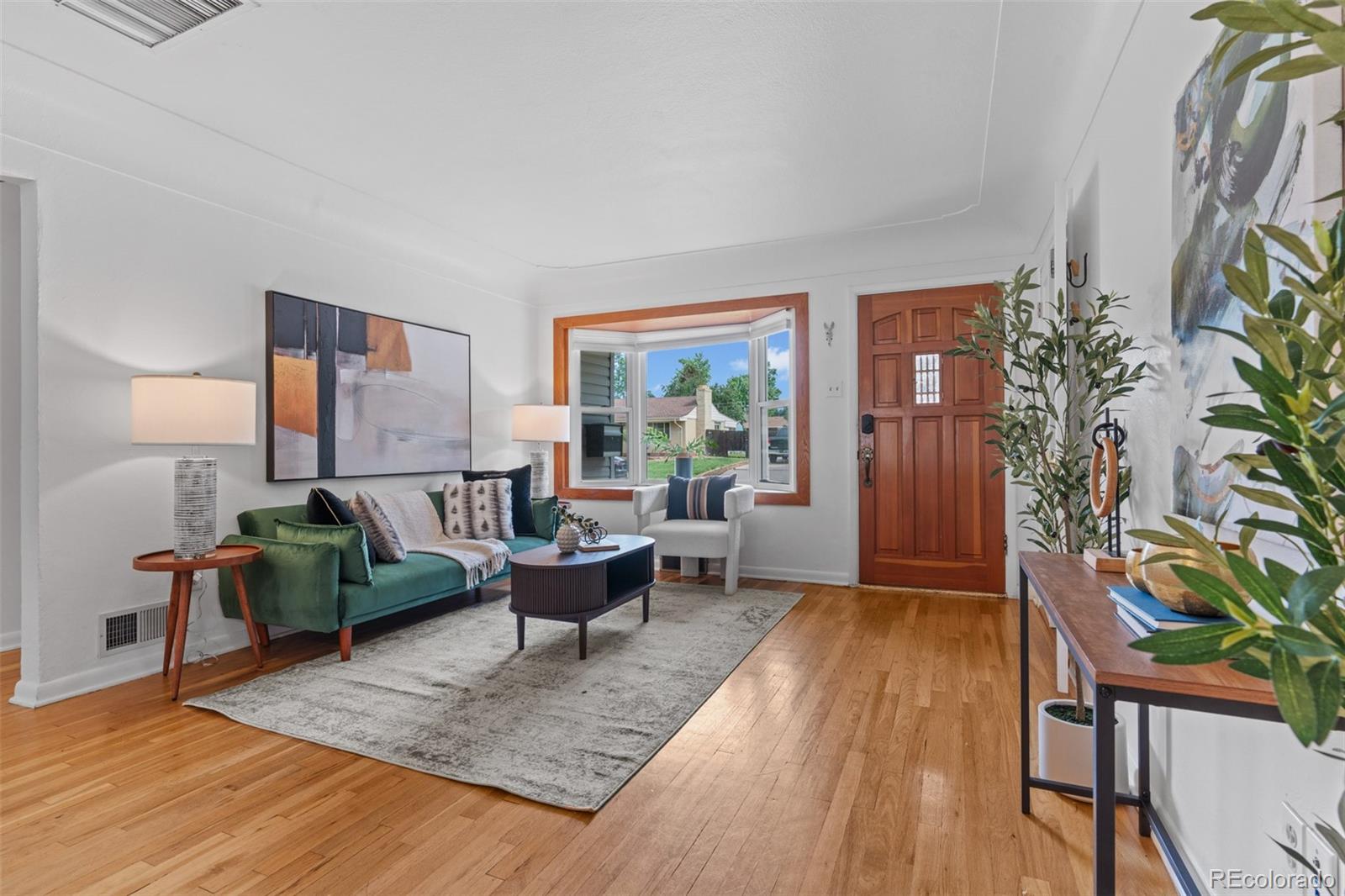 6755 West 45th Avenue Wheat Ridge, CO 80033 - Photo 5 of 27 a living room with furniture and a potted plant