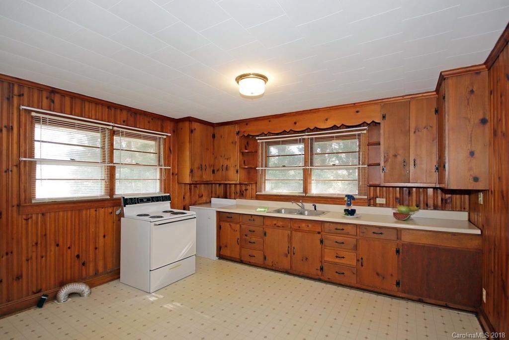 150 Rockwell Road Rockwell, NC 28138 - Photo 14 of 34 a kitchen that has a sink a stove and cabinets