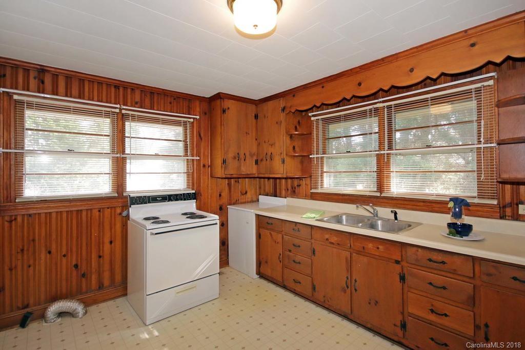 150 Rockwell Road Rockwell, NC 28138 - Photo 16 of 34 a kitchen with a stove a sink and a window
