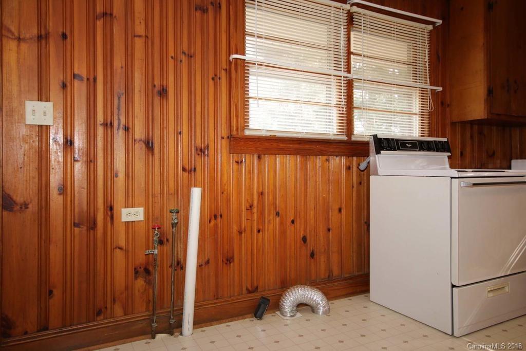150 Rockwell Road Rockwell, NC 28138 - Photo 20 of 34 a bathroom with a window and a shower curtain