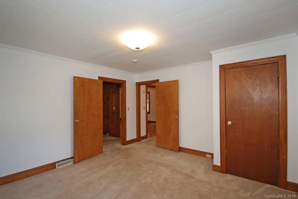150 Rockwell Road Rockwell, NC 28138 - Photo 26 of 34 an empty room with closet and wooden door