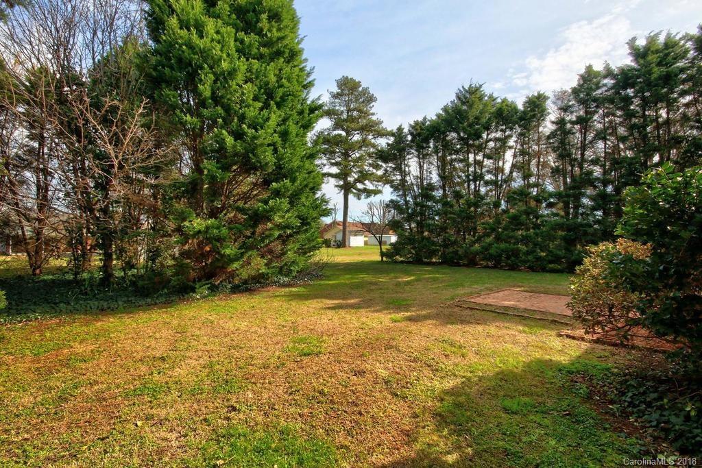 150 Rockwell Road Rockwell, NC 28138 - Photo 31 of 34 a view of a yard with a trees