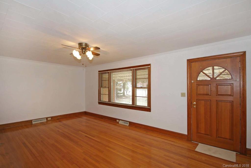 150 Rockwell Road Rockwell, NC 28138 - Photo 5 of 34 a view of an empty room with wooden floor and a window