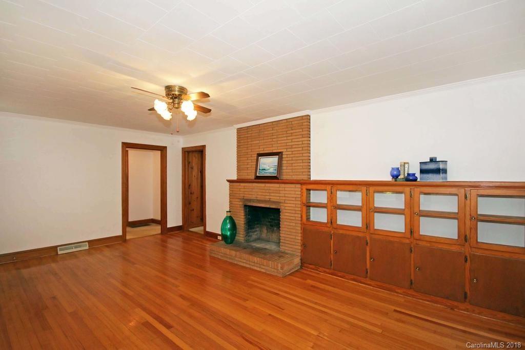 150 Rockwell Road Rockwell, NC 28138 - Photo 8 of 34 a view of a livingroom with wooden floor and a fireplace