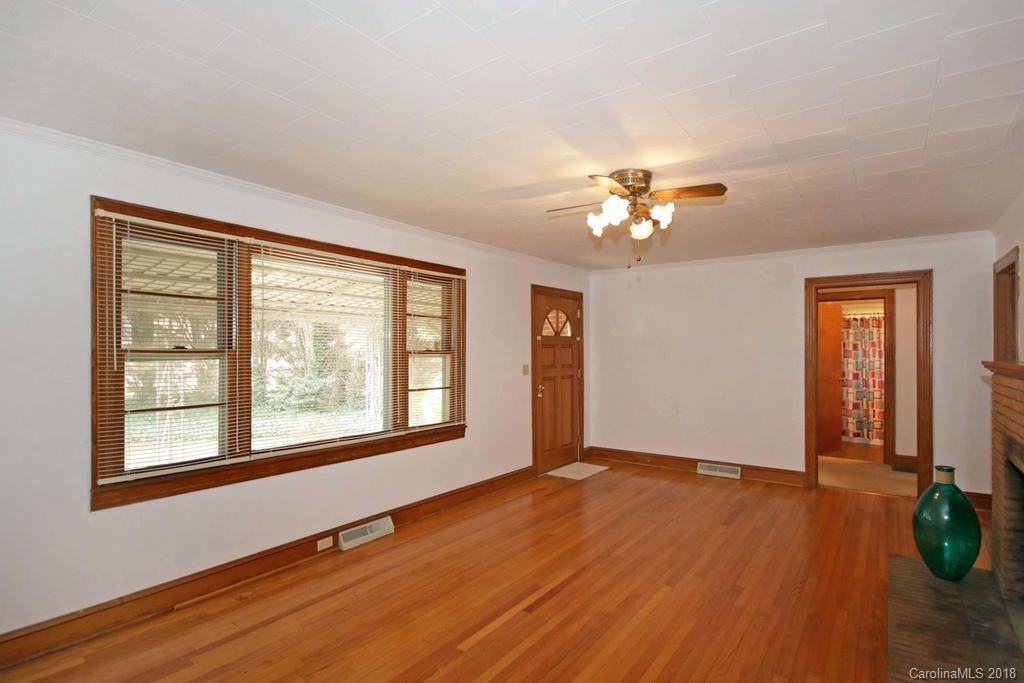 150 Rockwell Road Rockwell, NC 28138 - Photo 9 of 34 a view of an empty room with a window and wooden floor