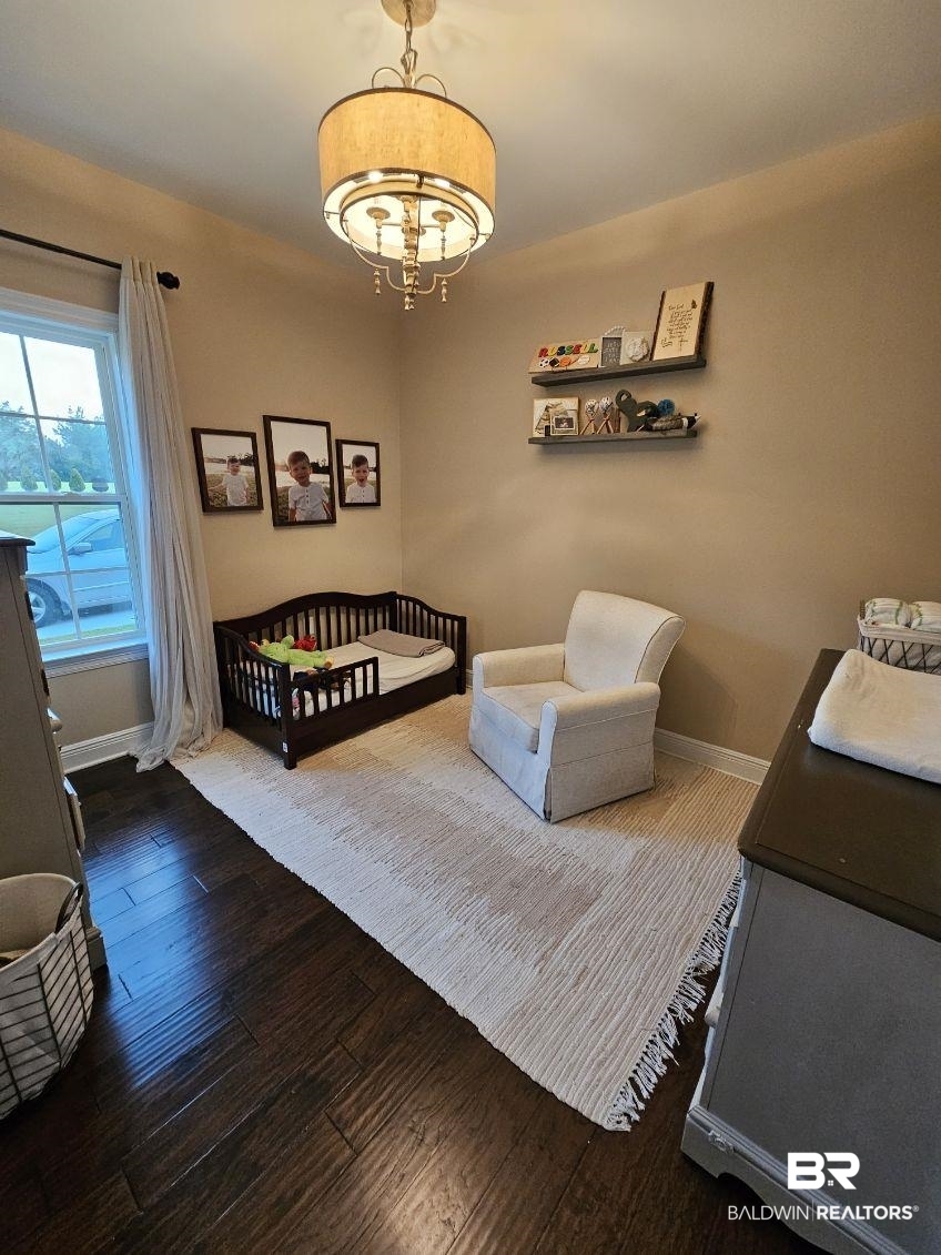 41416 Davis Duck Road Bay Minette, AL 36507 - Photo 56 of 72 Bedroom featuring a crib and wood-type flooring