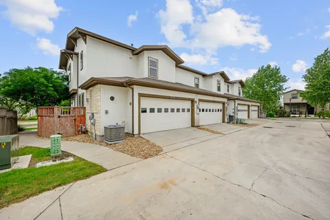 a view of a house with a yard and garage