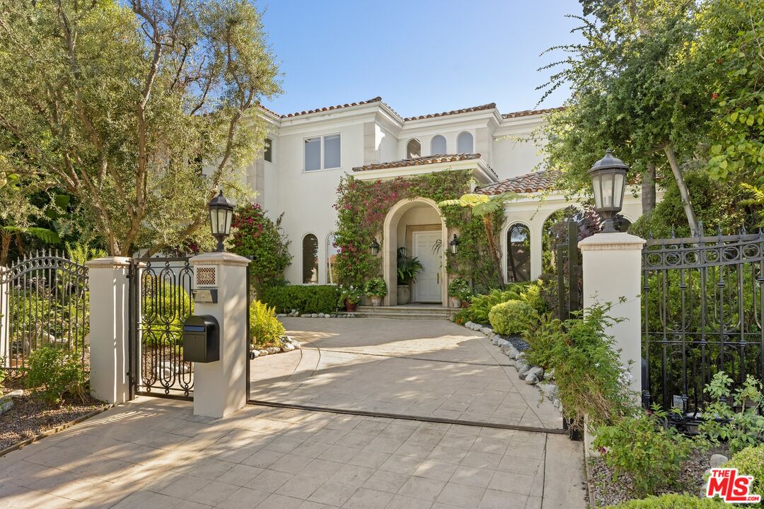 625 Foothill Road Beverly Hills, CA 90210 - Photo 1 of 22 a view of a street with a building in the background