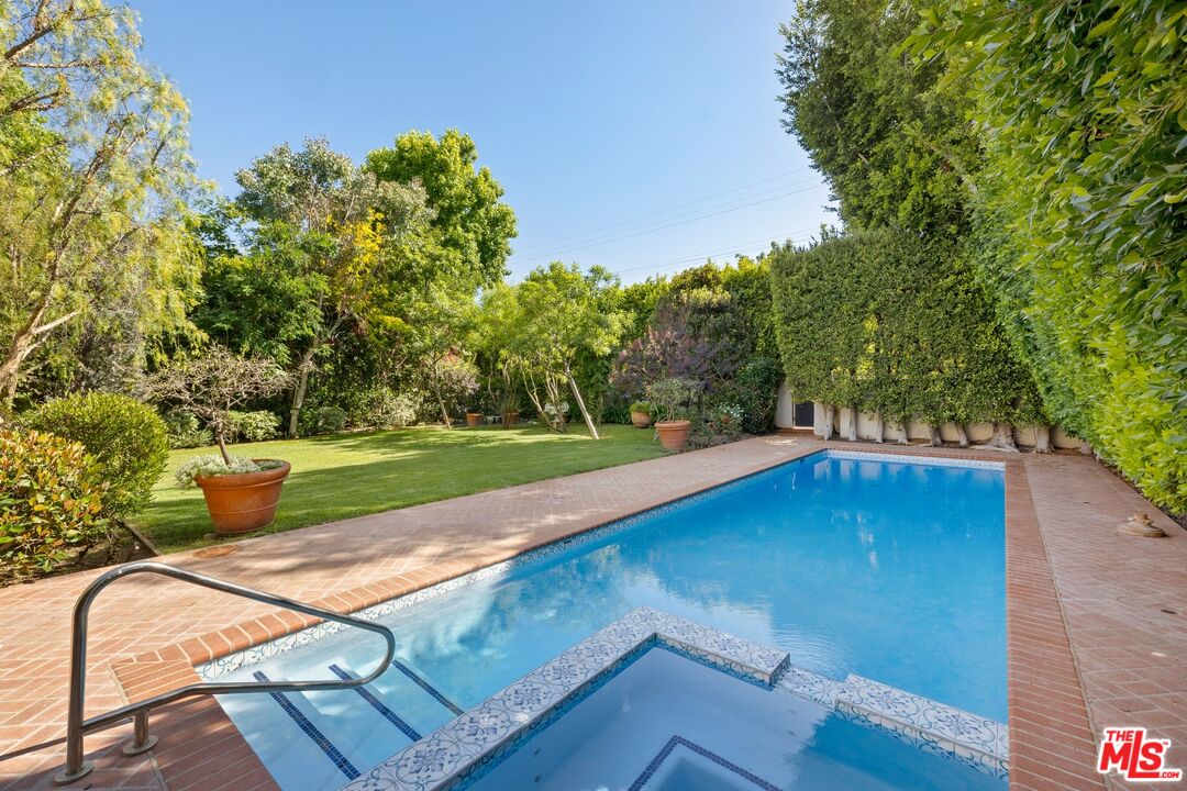 625 Foothill Road Beverly Hills, CA 90210 - Photo 11 of 22 a view of a mini pool with an outdoor space and deck