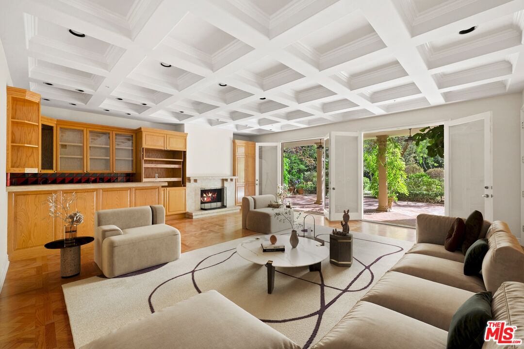 625 Foothill Road Beverly Hills, CA 90210 - Photo 12 of 22 a living room with furniture and a large window