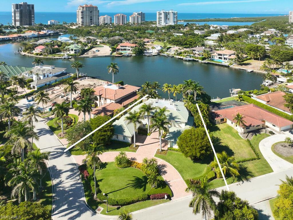 377 Pirates Bight Naples, FL 34103 - Photo 7 of 44 an aerial view of lake residential house with outdoor space