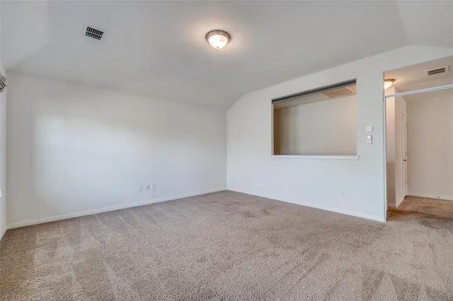 an empty room with a empty space and windows