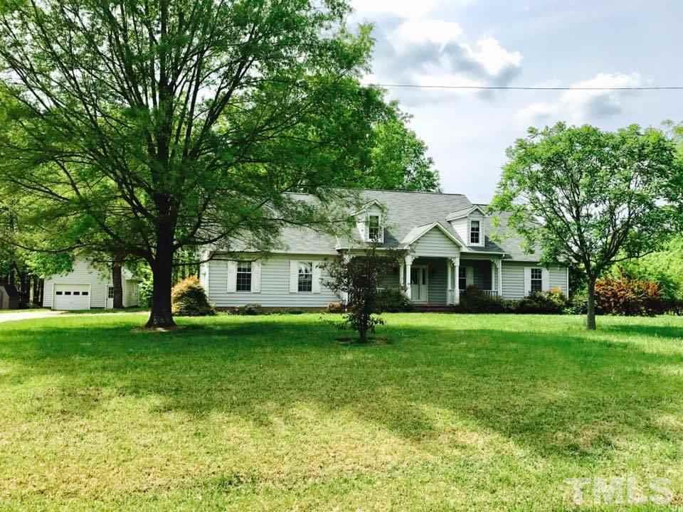 144 Ruff Davis Road Roxboro, NC 27574 - Photo 1 of 16 a front view of a house with a yard