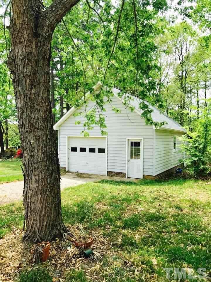 144 Ruff Davis Road Roxboro, NC 27574 - Photo 2 of 16 a view of a house in a garden