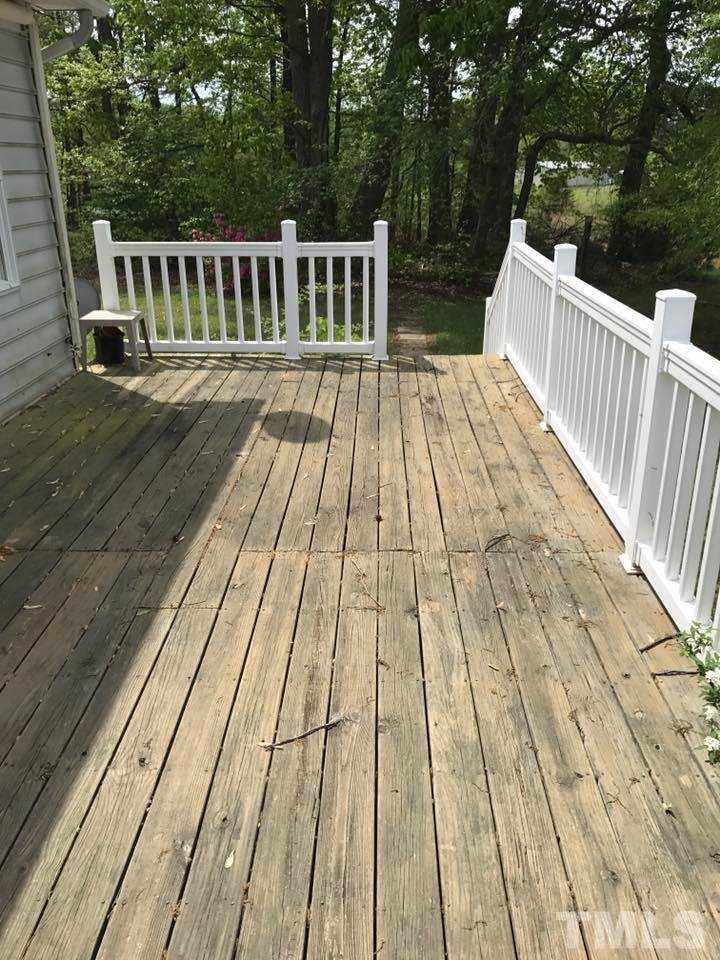 144 Ruff Davis Road Roxboro, NC 27574 - Photo 16 of 16 a view of backyard with a deck and wooden floor
