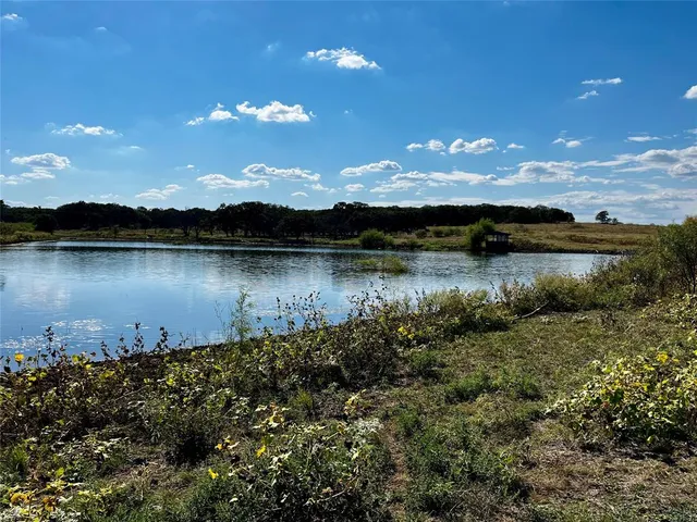 a view of a lake in middle of a house