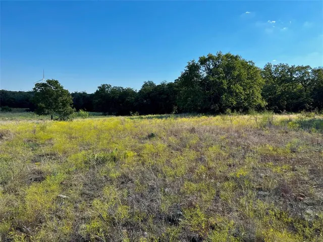 a view of lake with mountain in background