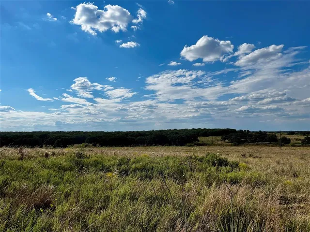 a view of an ocean and a mountain