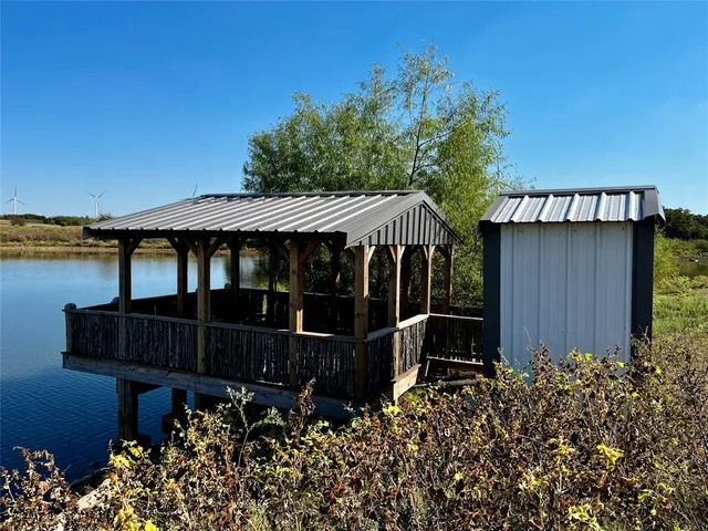 a view of a house with wooden floor and a yard