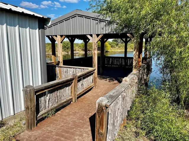 a view of swimming pool with outdoor seating