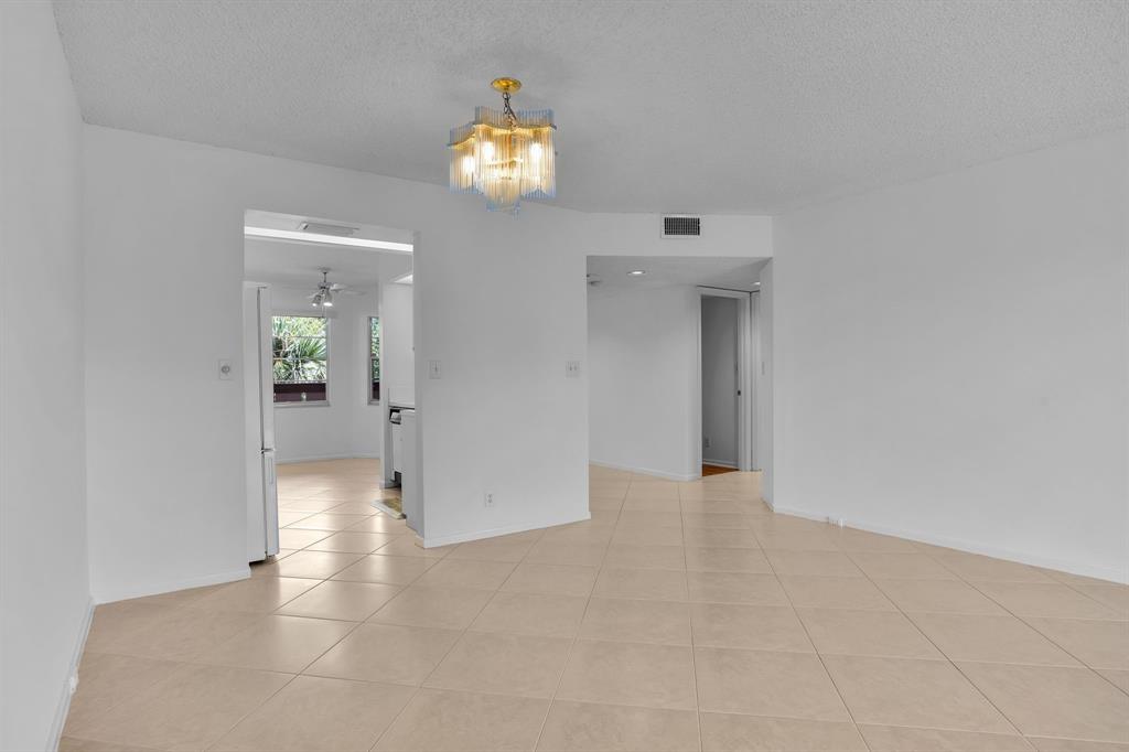 1601 Abaco Drive, Unit D4 Coconut Creek, FL 33066 - Photo 12 of 30 a view of an empty room and wooden floor