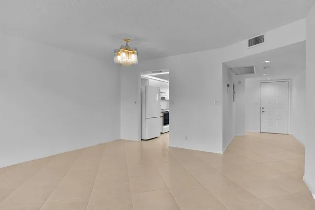 a bathroom with a double vanity sink a mirror and a shower