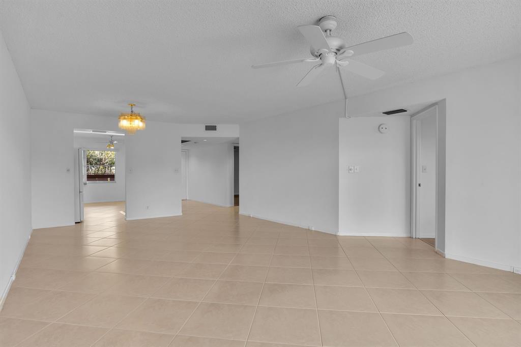 1601 Abaco Drive, Unit D4 Coconut Creek, FL 33066 - Photo 17 of 30 a view of an empty room with a ceiling fan