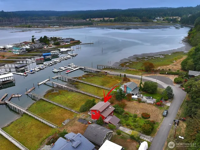 an aerial view of a house with a ocean view