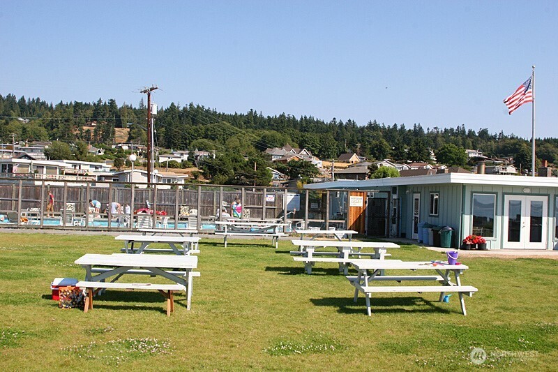 8122 Autumn Lane Clinton, WA 98236 - Photo 29 of 35 a view of a swimming pool with lounge chairs